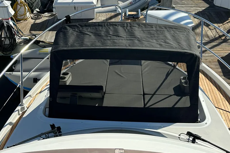 Slide: The Image of 2023 Beneteau Antares 11 Fly with covered seating area on deck. - 84