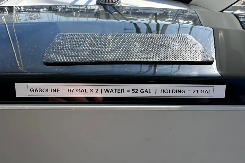 Slide: The Image of 2023 Beneteau Antares 11 Fly fuel and water capacity label on deck. - 99