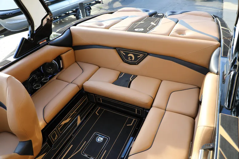 Slide: The Image of Luxurious interior of 2025 Centurion Nv213 boat with tan leather seating. - 10