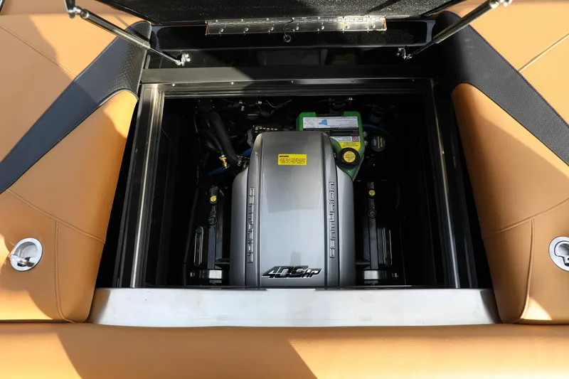 Slide: The Image of 2025 Centurion Nv213 engine compartment with tan upholstery and visible components. - 13