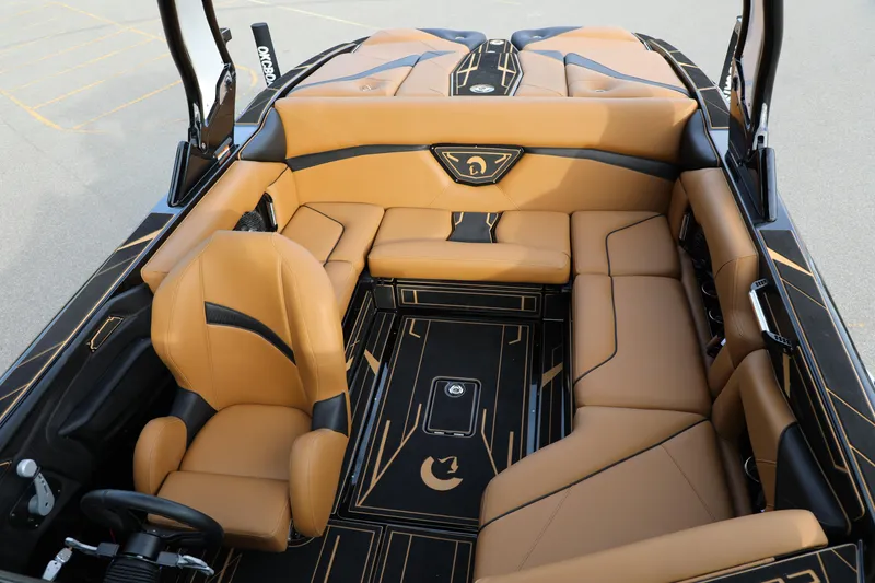 Slide: The Image of Luxurious interior of 2025 Centurion Nv213 boat with tan leather seating and sleek design. - 14