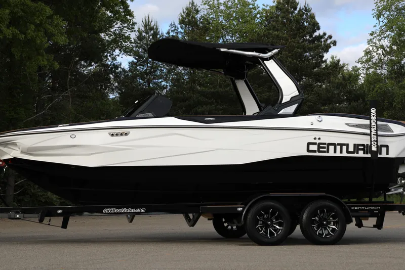 Slide: The Image of 2025 Centurion Nv213 boat on trailer, sleek design, parked outdoors. - 17
