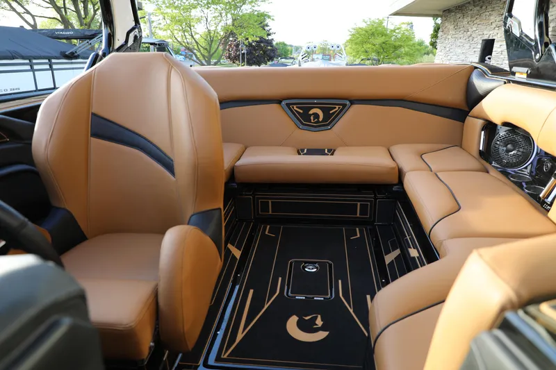 Slide: The Image of Luxurious interior of 2025 Centurion Nv213 boat with tan leather seating and modern design. - 30