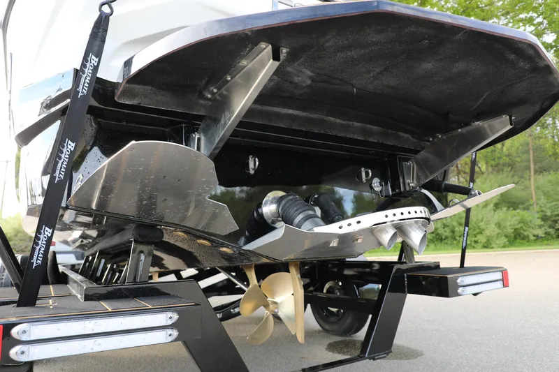 Slide: The Image of Rear view of 2025 Centurion Nv213 boat showing propeller and hull details. - 32