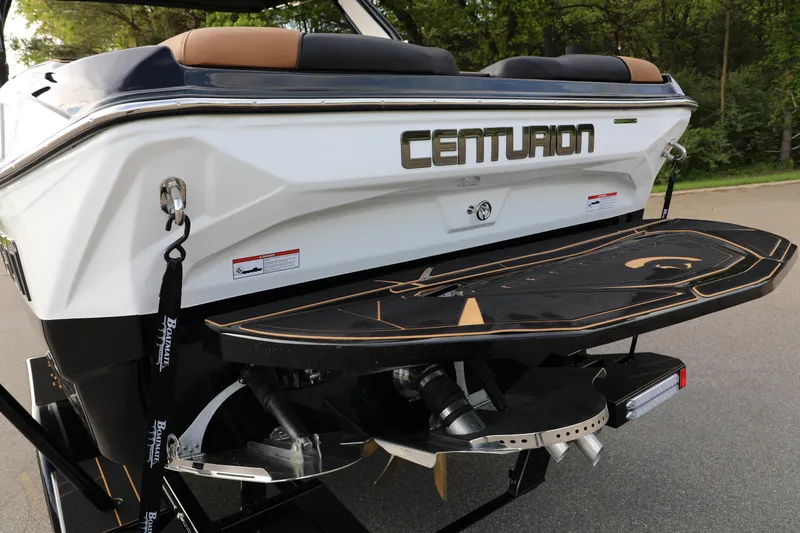 Slide: The Image of 2025 Centurion Nv213 boat rear view with swim platform and propeller. - 33