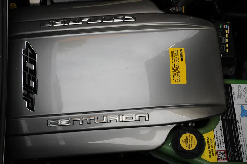 Slide: The Image of Engine cover of 2025 Centurion Nv213 with 409HP label and warning sticker. - 37