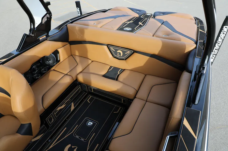 Slide: The Image of Luxurious interior of 2025 Centurion Nv213 boat with tan leather seating and sleek design. - 42