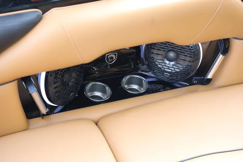 Slide: The Image of 2025 Centurion Nv213 interior with tan leather seats, built-in speakers, and cup holders. - 45