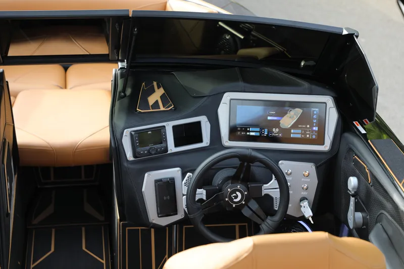 Slide: The Image of Interior of 2025 Centurion Nv213 boat with advanced dashboard and touchscreen controls. - 5