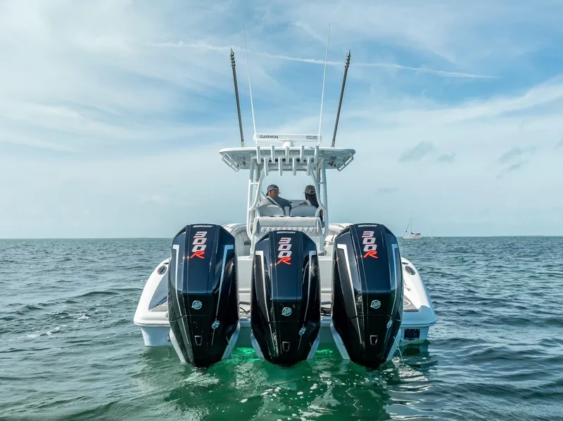 Slide: The Image of 2020 Yellowfin 34 boat with triple outboard engines on open water. - 13