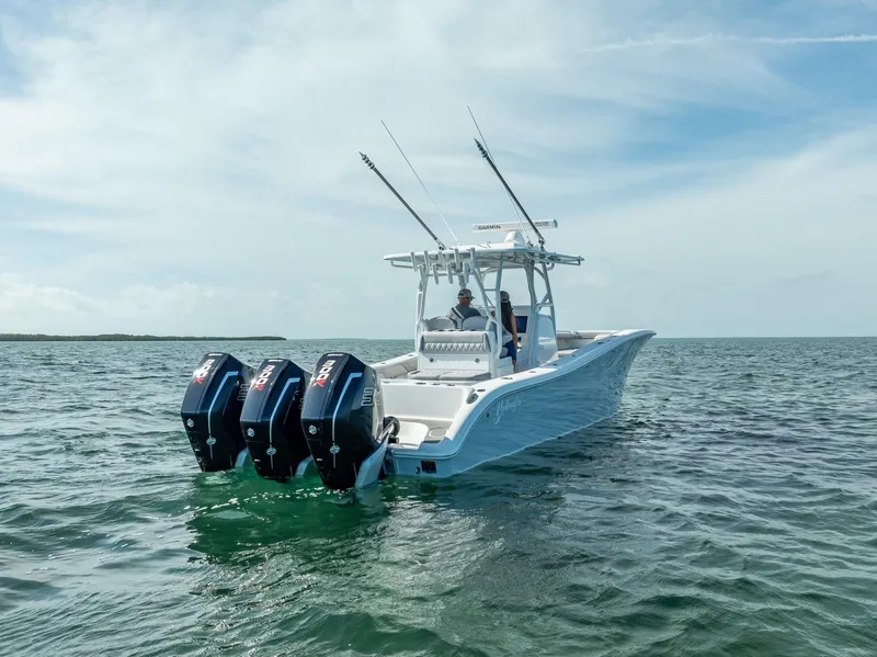 Slide: The Image of 2020 Yellowfin 34 boat with triple outboard engines on open water. - 14