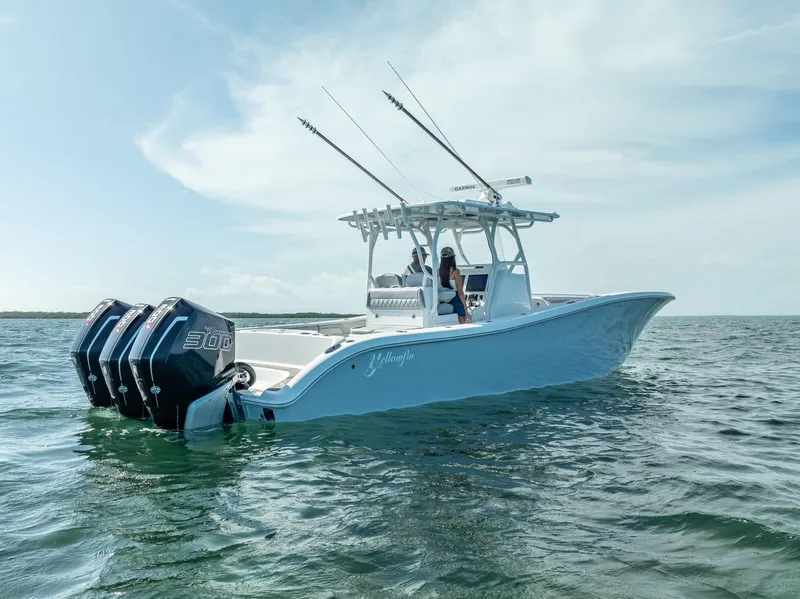 Slide: The Image of 2020 Yellowfin 34 boat on open water with triple outboard engines. - 15