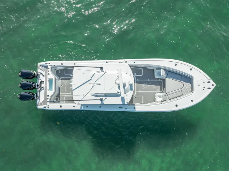 Slide: The Image of Aerial view of 2020 Yellowfin 34 boat on clear green water. - 16