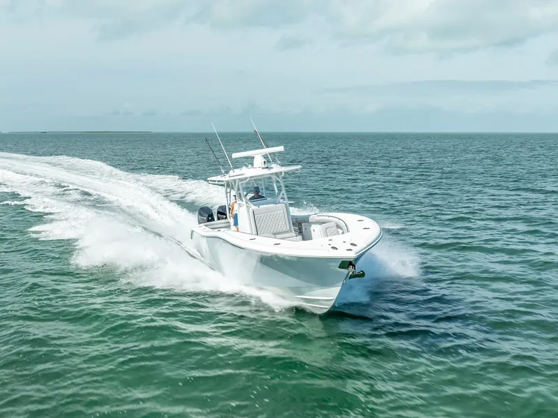 Slide: The Image of 2020 Yellowfin 34 boat cruising on open water. - 21