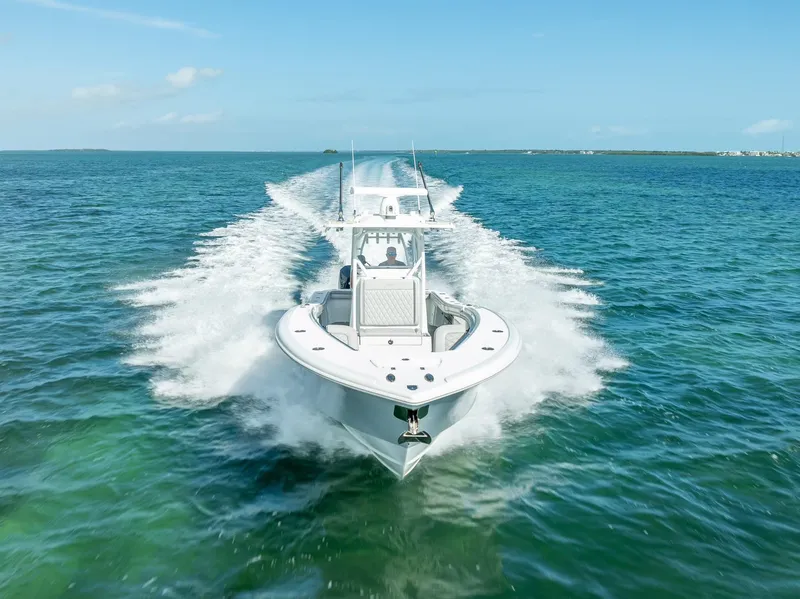 Slide: The Image of 2020 Yellowfin 34 boat cruising on clear blue ocean waters. - 25