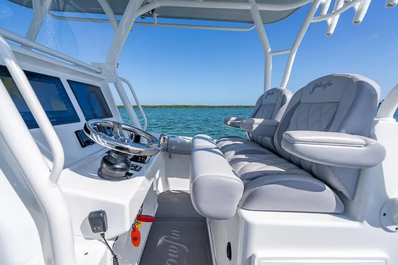 Slide: The Image of 2020 Yellowfin 34 boat interior with sleek helm and comfortable seating. - 31