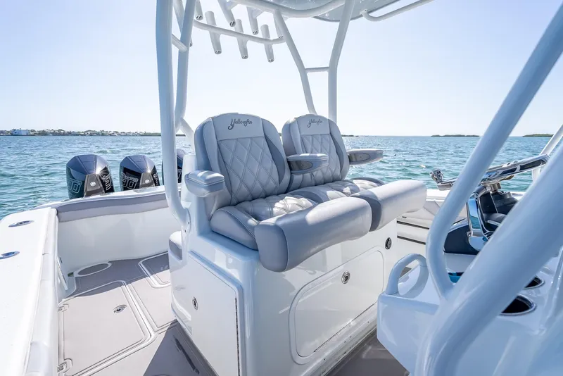 Slide: The Image of 2020 Yellowfin 34 boat interior with luxury seating and dual engines on the water. - 35