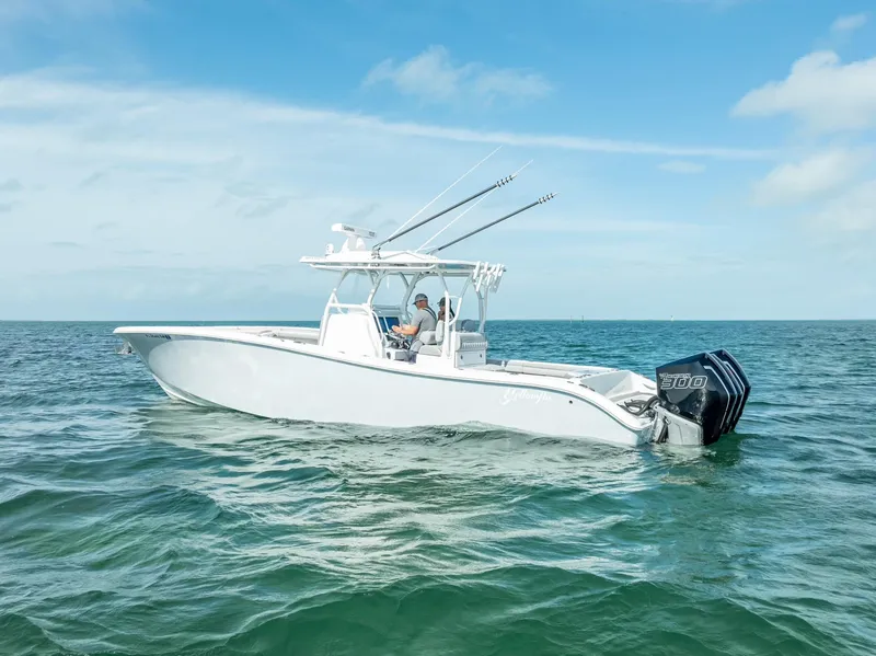 Slide: The Image of 2020 Yellowfin 34 boat on open water under blue sky. - 4