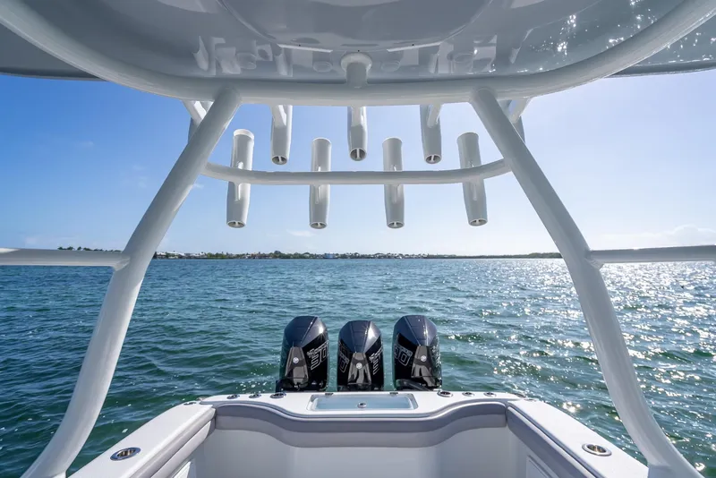 Slide: The Image of 2020 Yellowfin 34 boat with triple engines on open water under clear blue sky. - 41