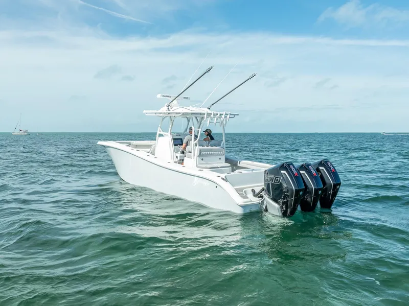 Slide: The Image of 2020 Yellowfin 34 boat with triple outboard engines on open water. - 5