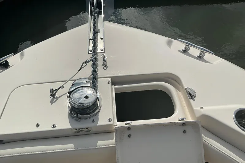 Slide: The Image of Bow of 2020 Grady-White Freedom 225 boat with anchor chain and winch. - 12