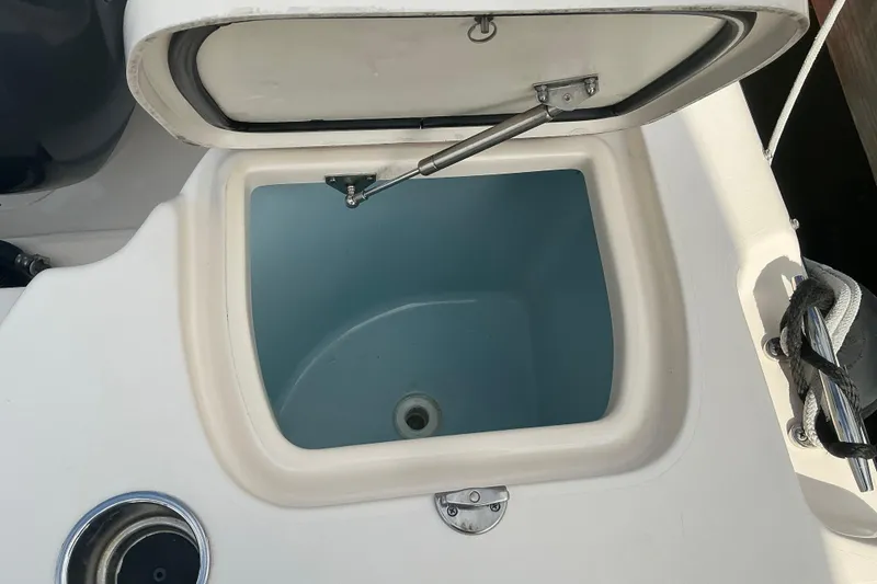 Slide: The Image of Open storage compartment on 2020 Grady-White Freedom 225 boat. - 19
