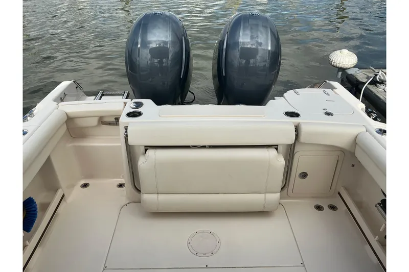 Slide: The Image of 2020 Grady-White Freedom 225 boat with dual outboard motors on water. - 9