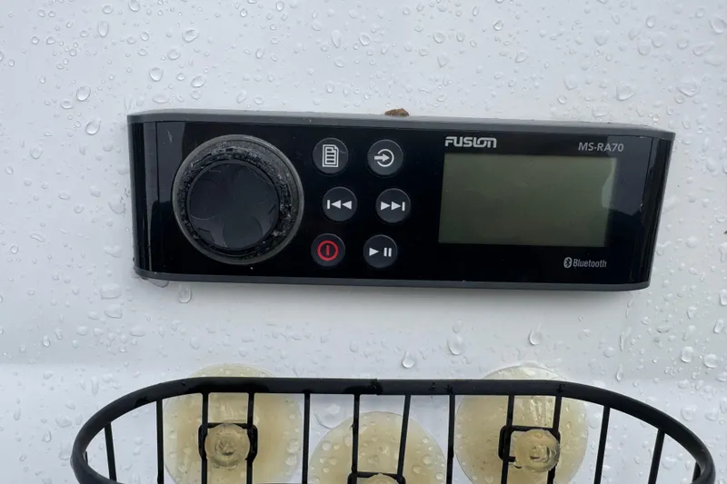 Slide: The Image of Fusion MS-RA70 marine stereo on 2019 Edgewater 188CC, wet surface, Bluetooth enabled. - 10