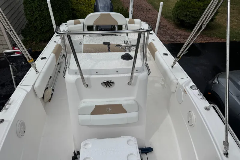 Slide: The Image of 2019 Edgewater 188CC boat interior with seating and steering console. - 12