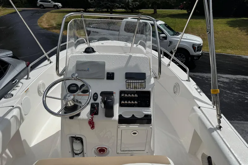 Slide: The Image of 2019 Edgewater 188CC boat dashboard with Garmin navigation system and steering wheel. - 15