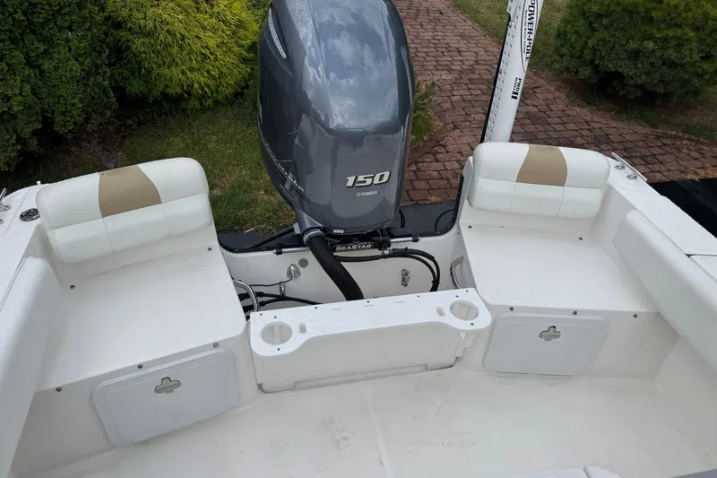 Slide: The Image of 2019 Edgewater 188CC boat with Yamaha 150 engine, featuring cushioned seating and storage compartments. - 5