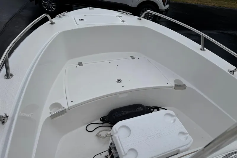 Slide: The Image of 2019 Edgewater 188CC boat interior with storage compartment and cooler. - 8