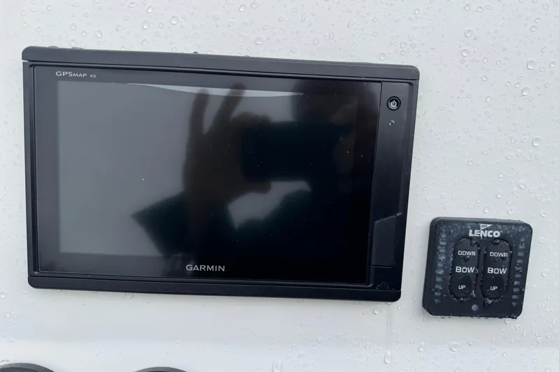 Slide: The Image of Garmin GPSMAP X5 and Lenco controls on 2019 Edgewater 188CC boat dashboard. - 9