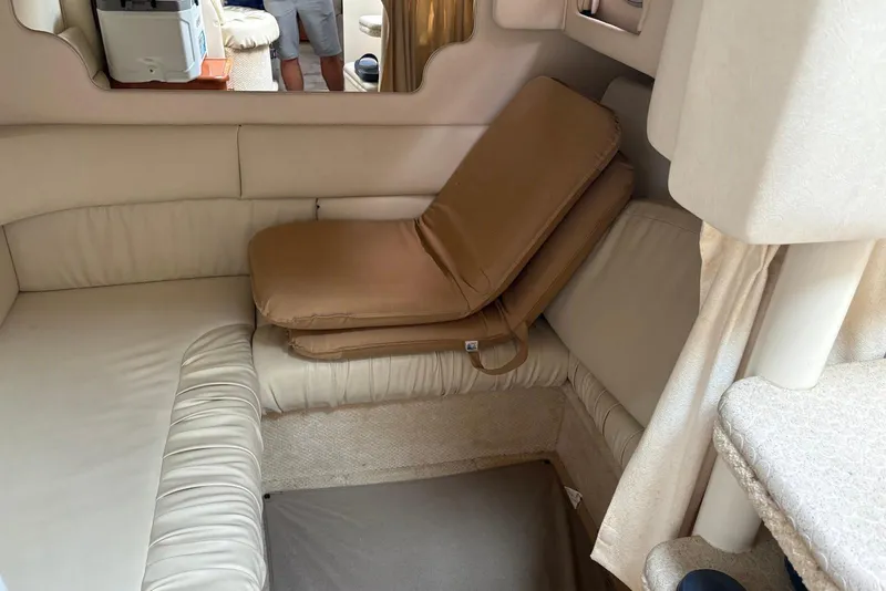 Slide: The Image of 2001 Sea Ray 340 Sundancer interior with beige seating and cushions. - 15