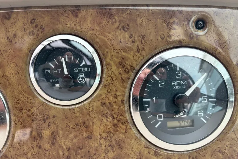 Slide: The Image of Close-up of 2001 Sea Ray 340 Sundancer boat gauges, showing RPM and sync indicators. - 22