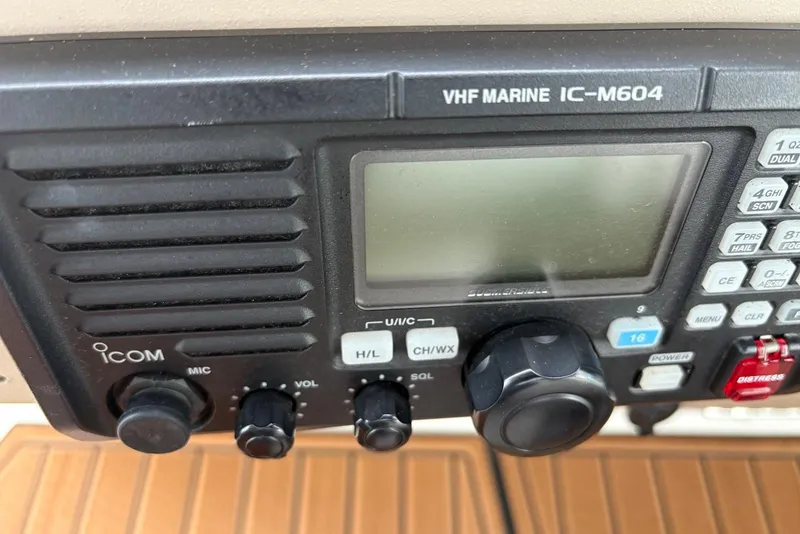 Slide: The Image of VHF marine radio IC-M604 on 2001 Sea Ray 340 Sundancer boat dashboard. - 23