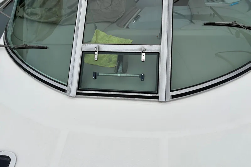 Slide: The Image of Windshield of 2001 Sea Ray 340 Sundancer boat with wipers and hatch. - 32