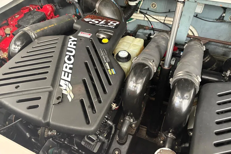 Slide: The Image of Engine compartment of a 2001 Sea Ray 340 Sundancer with Mercury components. - 36