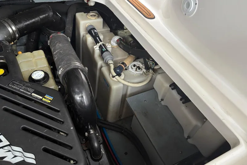 Slide: The Image of Engine compartment of a 2001 Sea Ray 340 Sundancer boat, showing mechanical components. - 39