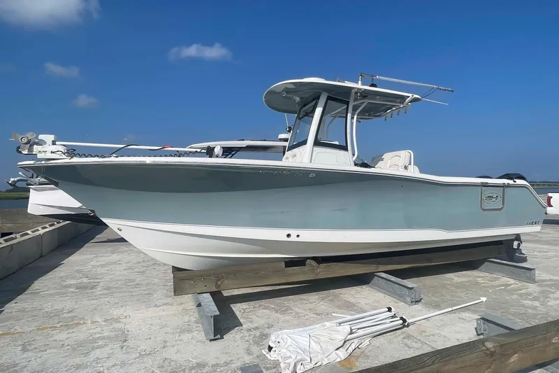 The Image of 2019 Sea Hunt Gamefish 27 boat on display under clear blue sky. - 0