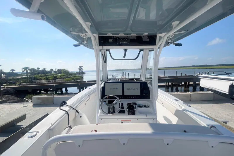 Slide: The Image of 2019 Sea Hunt Gamefish 27 boat at dock with Garmin navigation system. - 3