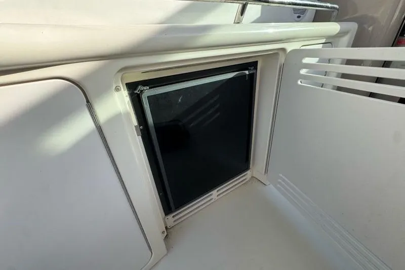 Slide: The Image of 2001 Sea Ray 380 Sundancer interior with built-in mini fridge. - 20