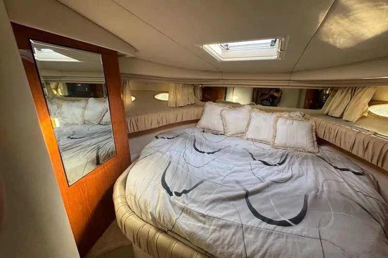 Slide: The Image of Luxurious cabin interior of 2001 Sea Ray 380 Sundancer yacht with cozy bedding. - 32