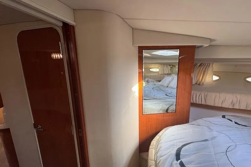 Slide: The Image of Interior cabin of 2001 Sea Ray 380 Sundancer with bed and mirror. - 35