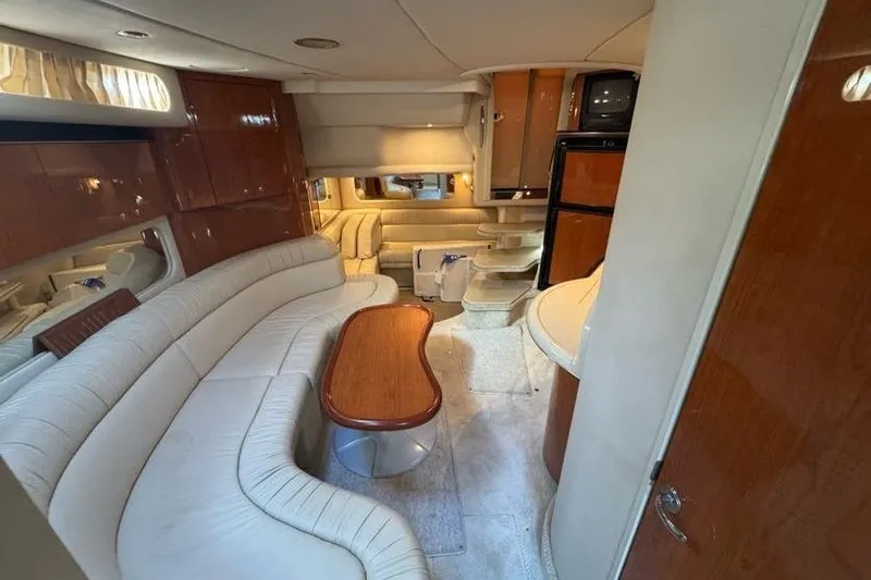 Slide: The Image of Luxurious interior of 2001 Sea Ray 380 Sundancer yacht with elegant seating and wooden finishes. - 41