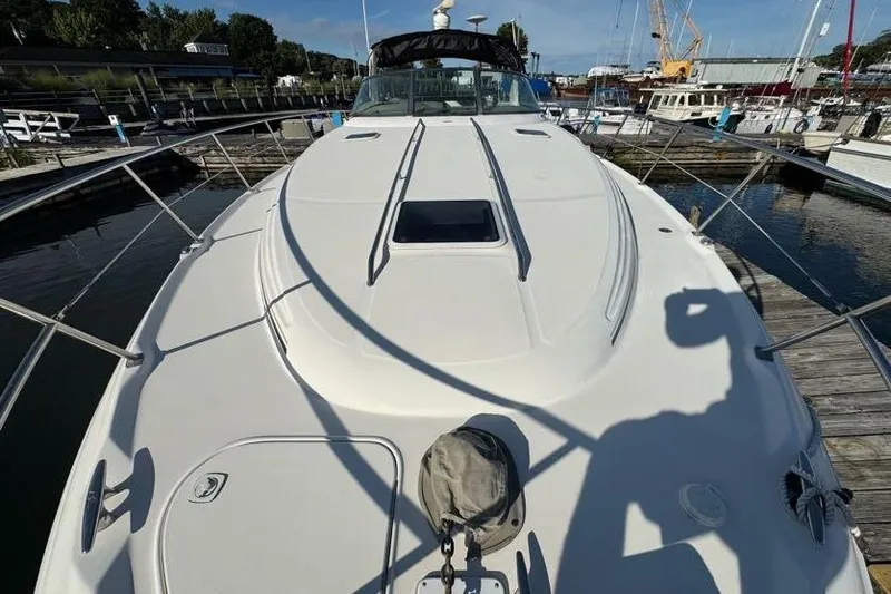 Slide: The Image of 2001 Sea Ray 380 Sundancer yacht docked at marina, viewed from bow. - 51