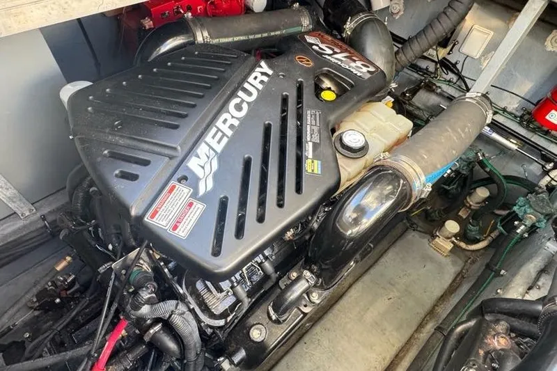 Slide: The Image of Engine compartment of a 2001 Sea Ray 380 Sundancer with Mercury engine. - 58