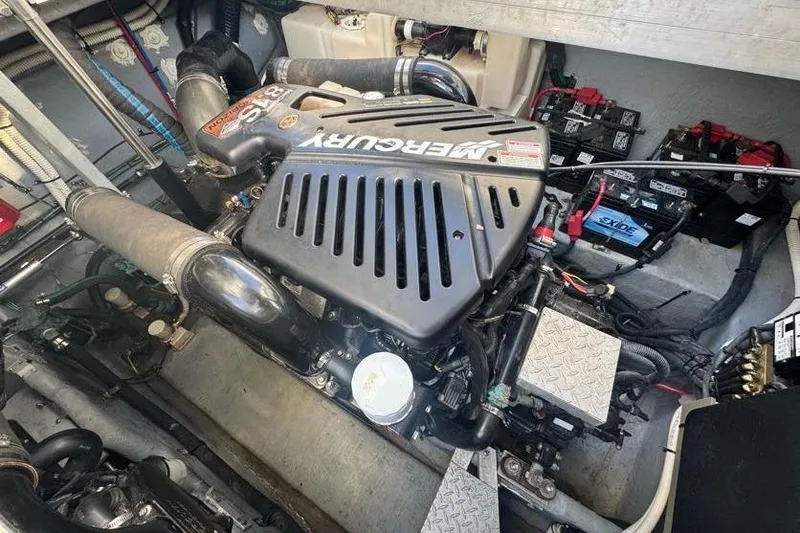 Slide: The Image of Engine compartment of a 2001 Sea Ray 380 Sundancer with Mercury engine and batteries. - 59