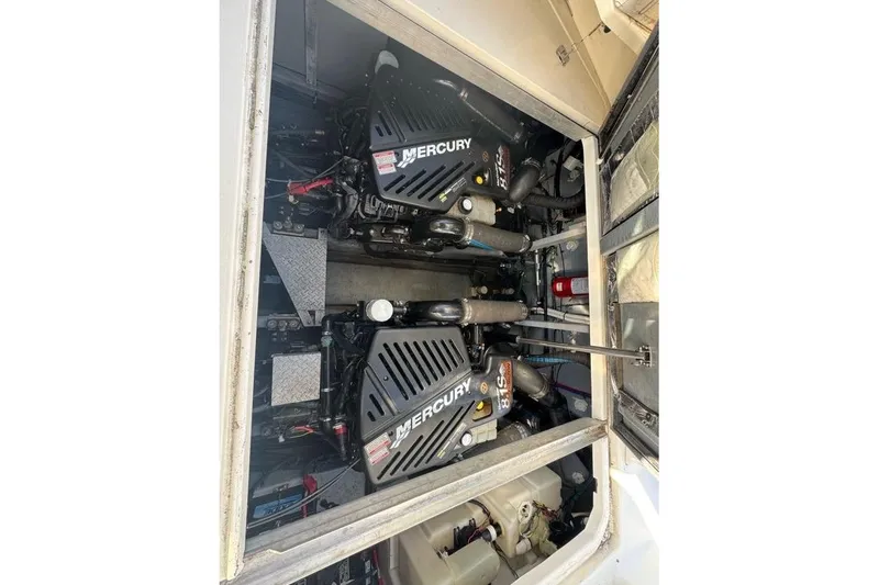Slide: The Image of Engine compartment of a 2001 Sea Ray 380 Sundancer with twin Mercury engines. - 60