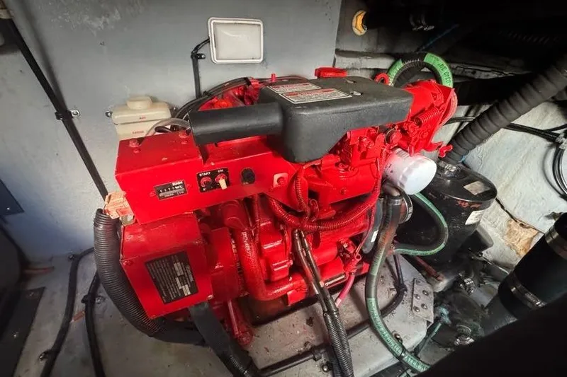 Slide: The Image of Engine room of 2001 Sea Ray 380 Sundancer with red marine engine. - 62